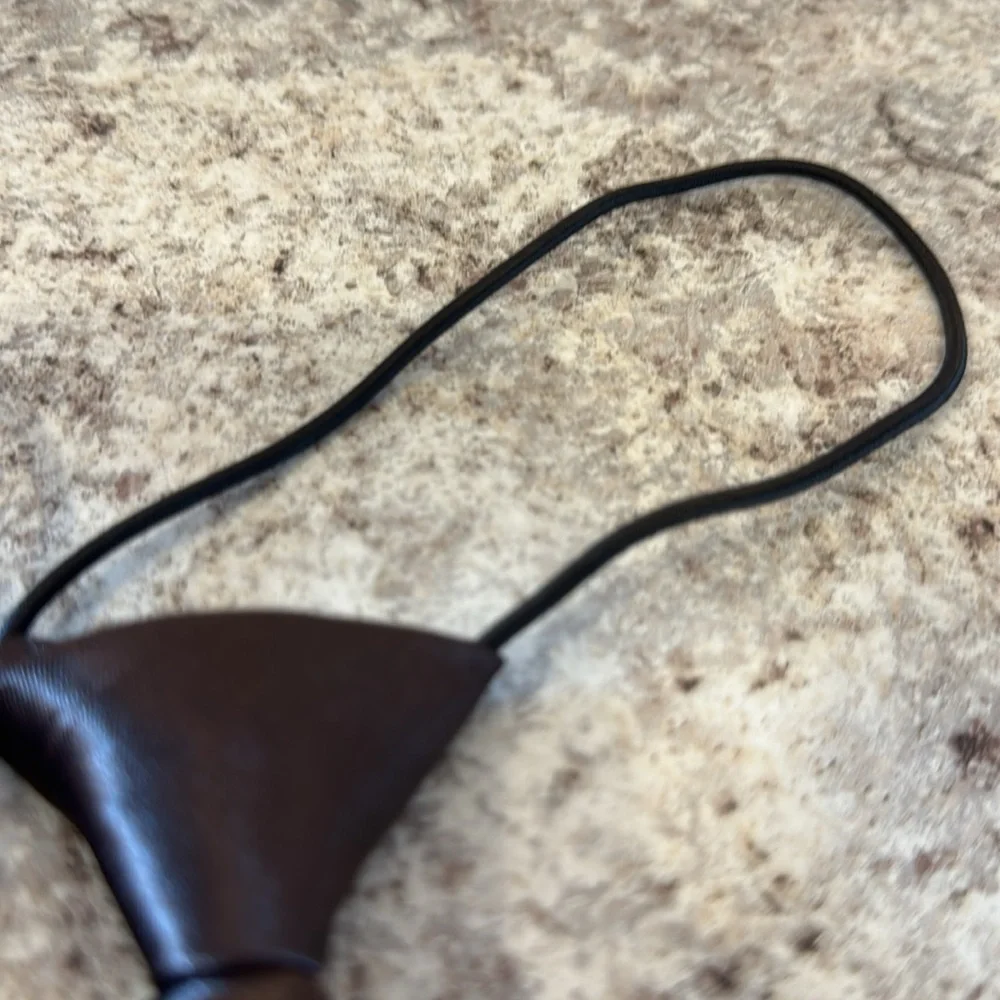 unisex Tie set of 4. Attached elastic cord goes under the collar 1 NWOT